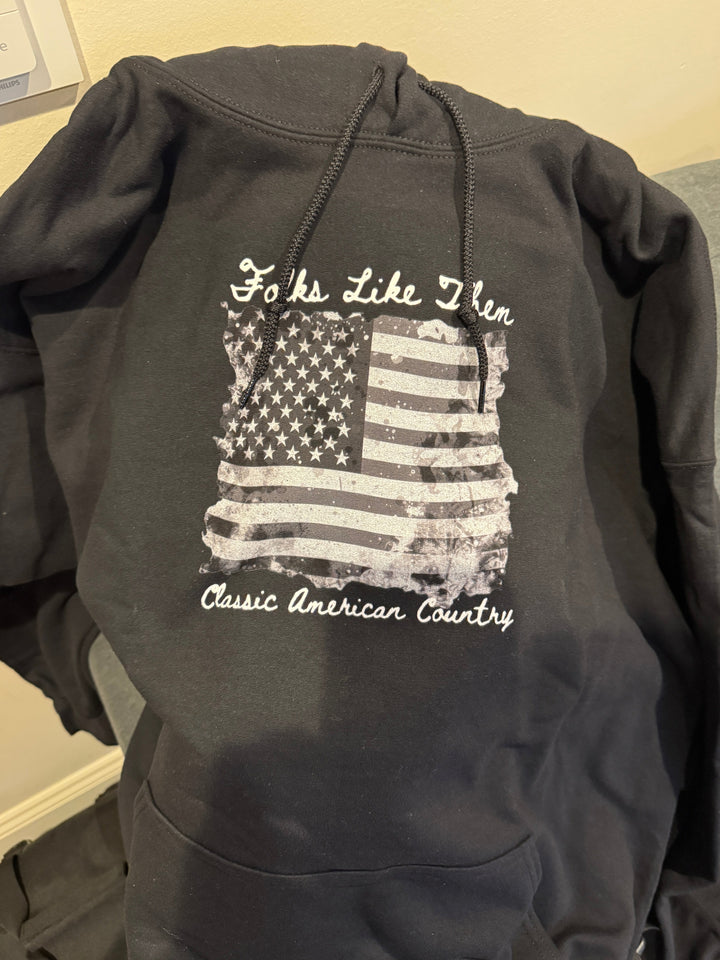 Black American Flag Classic Country Hoodie with "Folks Like Them" text, showcasing country music passion and style.